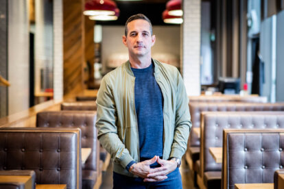 Deni poses in a Pizzeria Libretto location