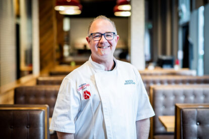 Chef Rocco poses in a Pizzeria Libretto location